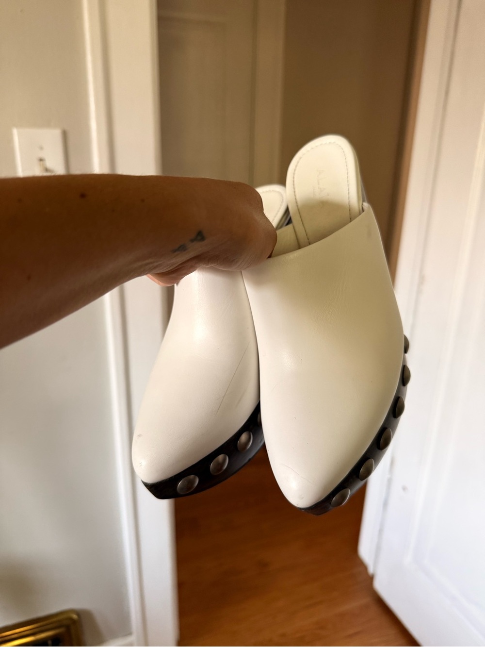 Alaia White Leather Pointed Mule Slides with Stud Trim